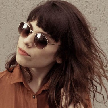 muvo-totally-naked-perfect-pair-bundle-02 Rich warm brunette wearing dark sunglasses and warm brown blouse