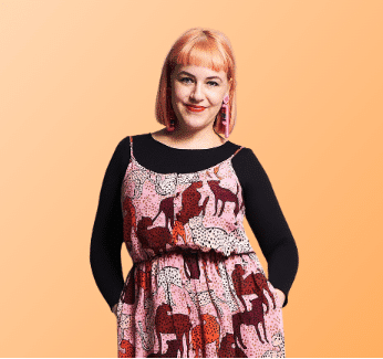 Kristina Russell with Peach hair on orange background