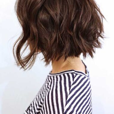 Lady side view short bob-hair cut